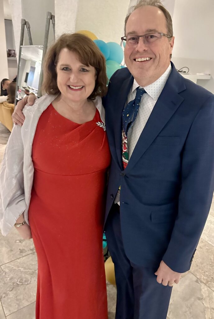 Linda and Gregg Swindling dressed up for a holiday party.